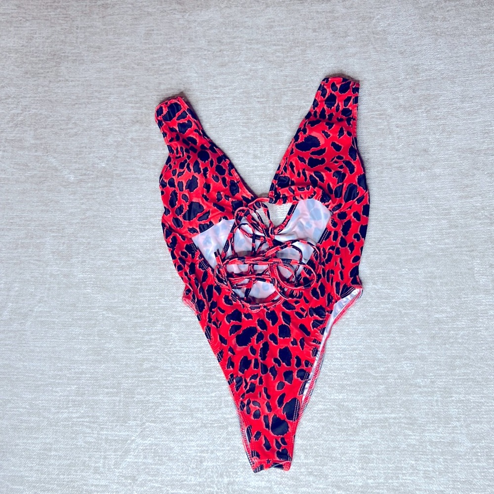 Cross body one piece